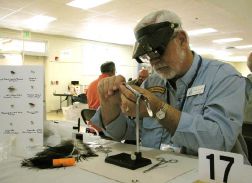 Man tying fly.